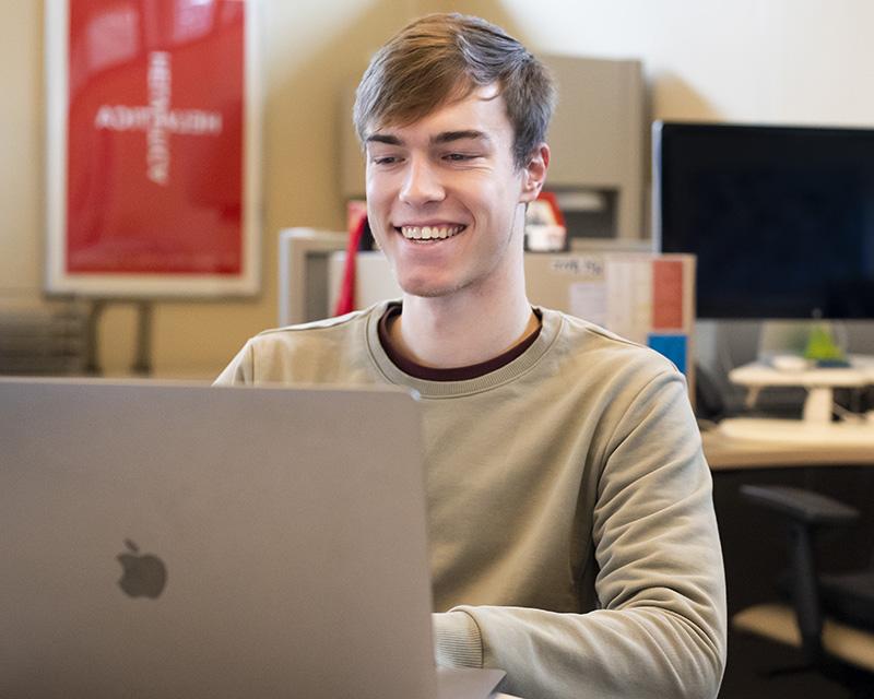 Student working at a laptop